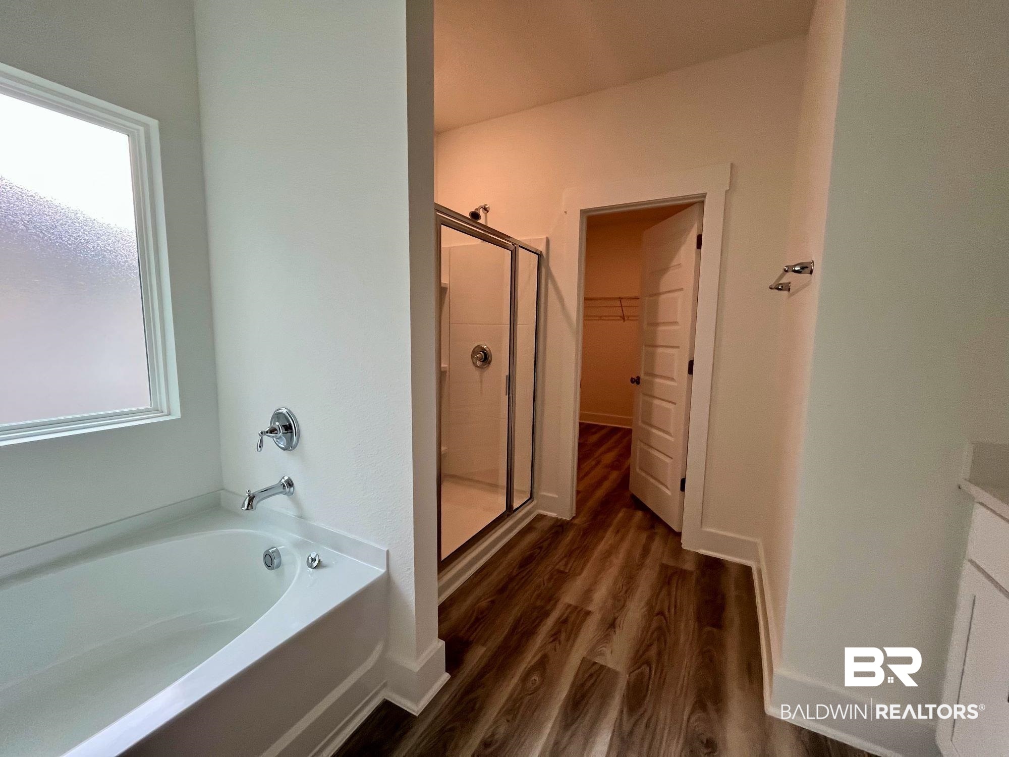 334 Barndling Street Fairhope, AL 36532 - Photo 29 of 34 Bathroom featuring plus walk in shower and hardwood / wood-style floors