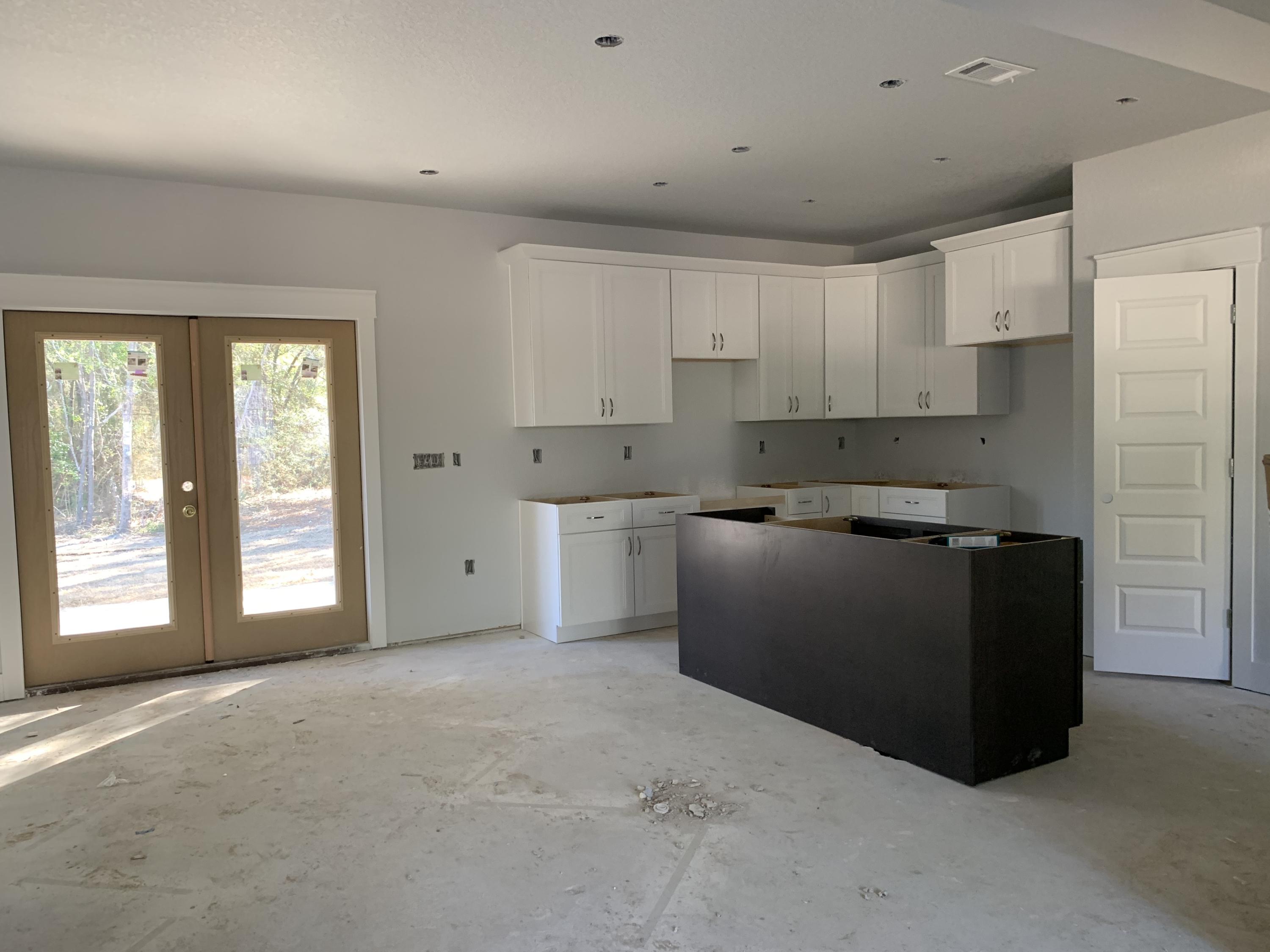 311 Arroyo Hondo Terrace Crestview, FL 32536 - Photo 6 of 12 a kitchen with cabinets and window