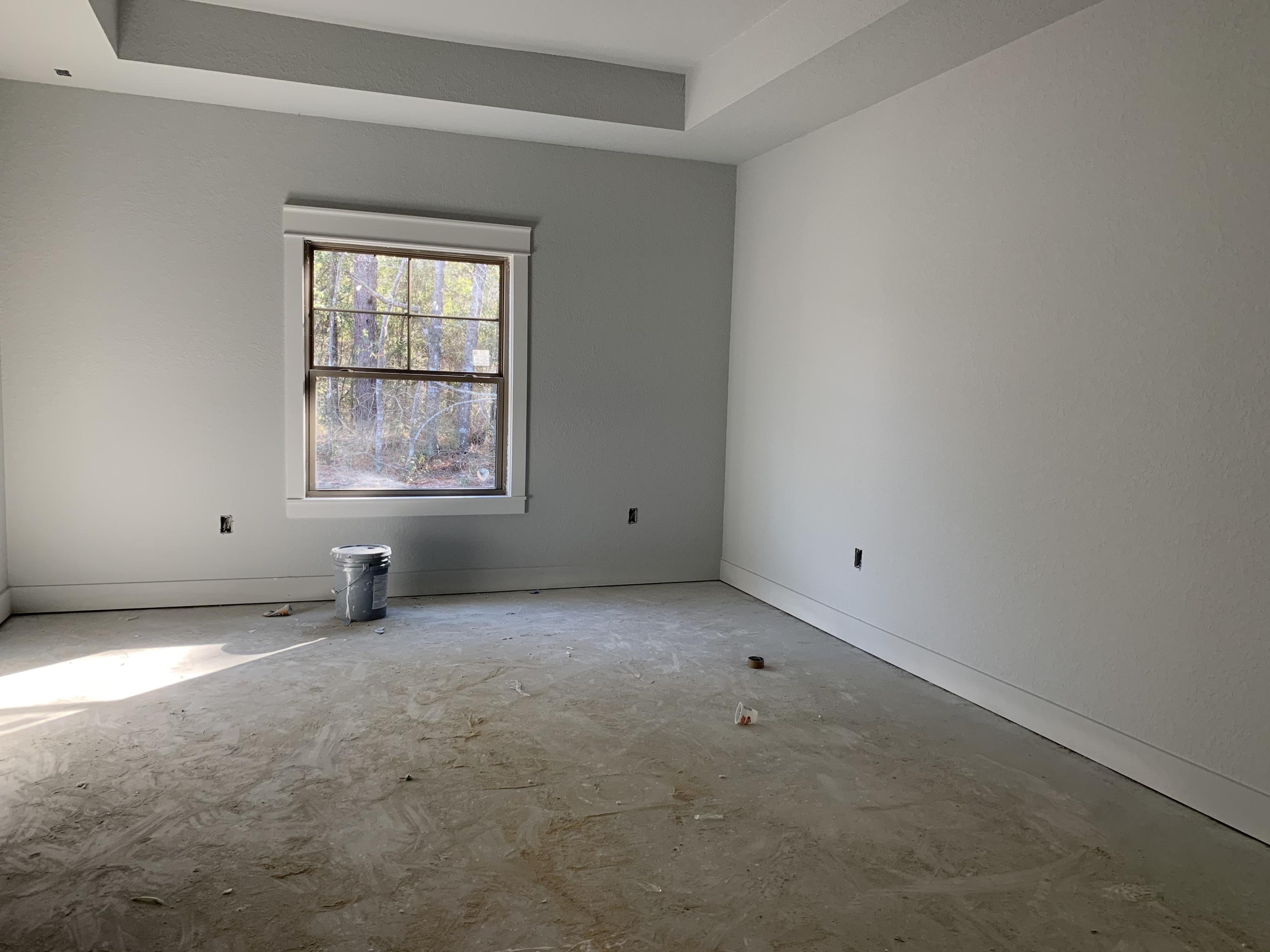 311 Arroyo Hondo Terrace Crestview, FL 32536 - Photo 8 of 12 an empty room with windows