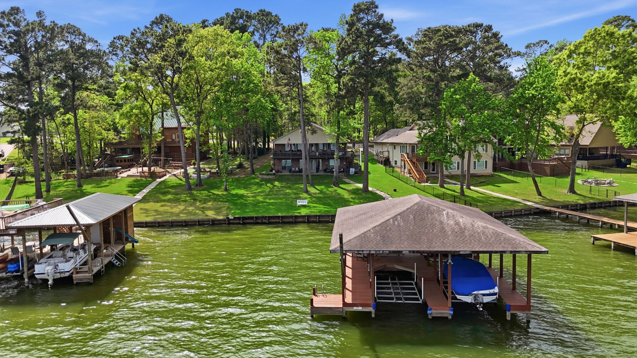 a view of house with swimming pool and outdoor seating