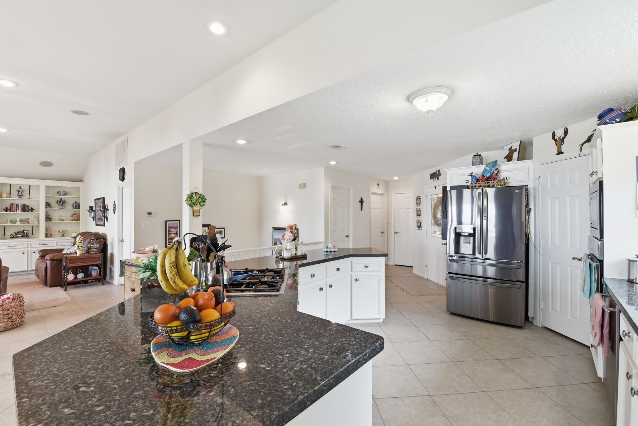 201 Lords Circle Coldspring, TX 77331 - Photo 12 of 48 a kitchen with stainless steel appliances granite countertop a refrigerator and a sink