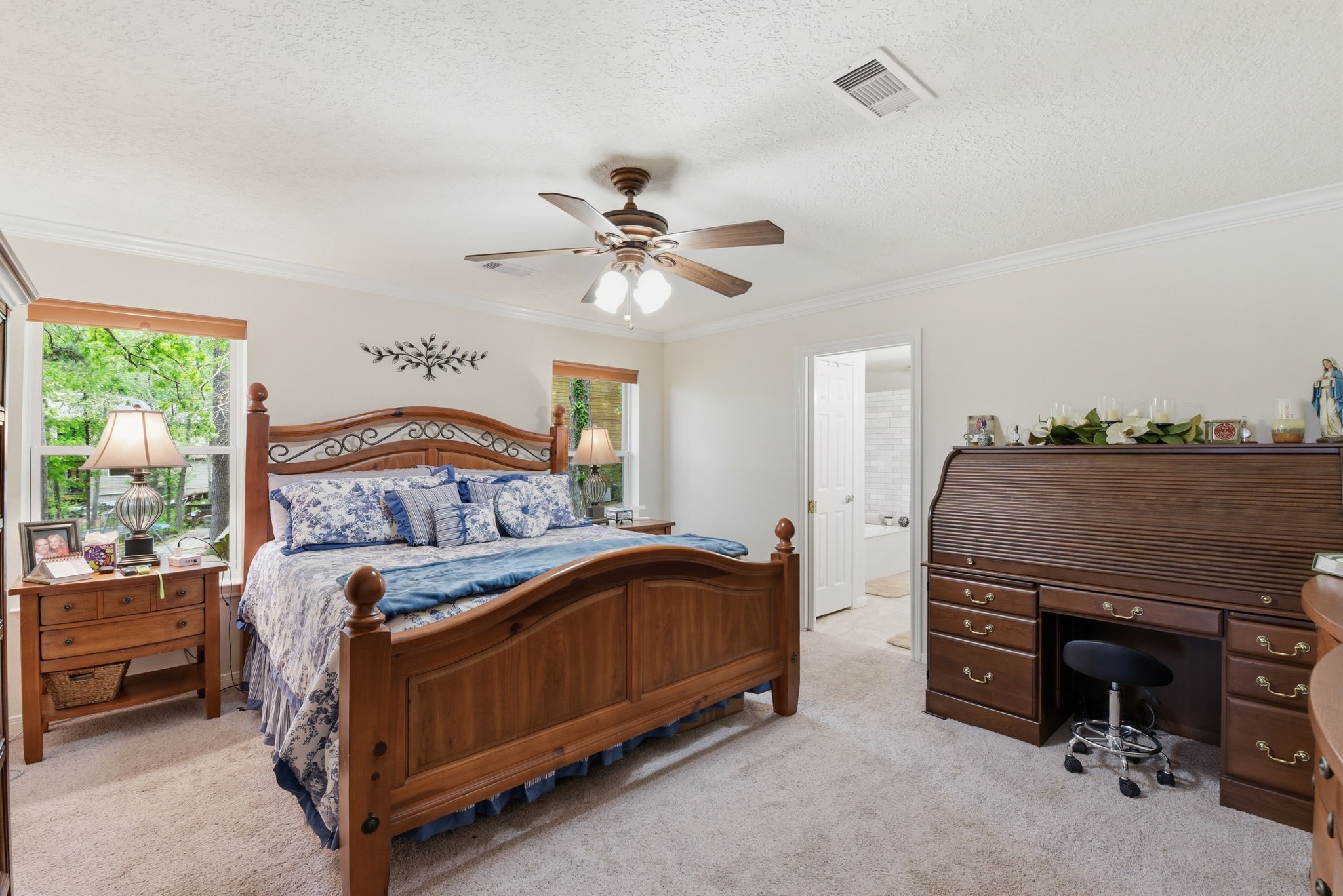 201 Lords Circle Coldspring, TX 77331 - Photo 20 of 48 a bedroom with a bed and a ceiling fan