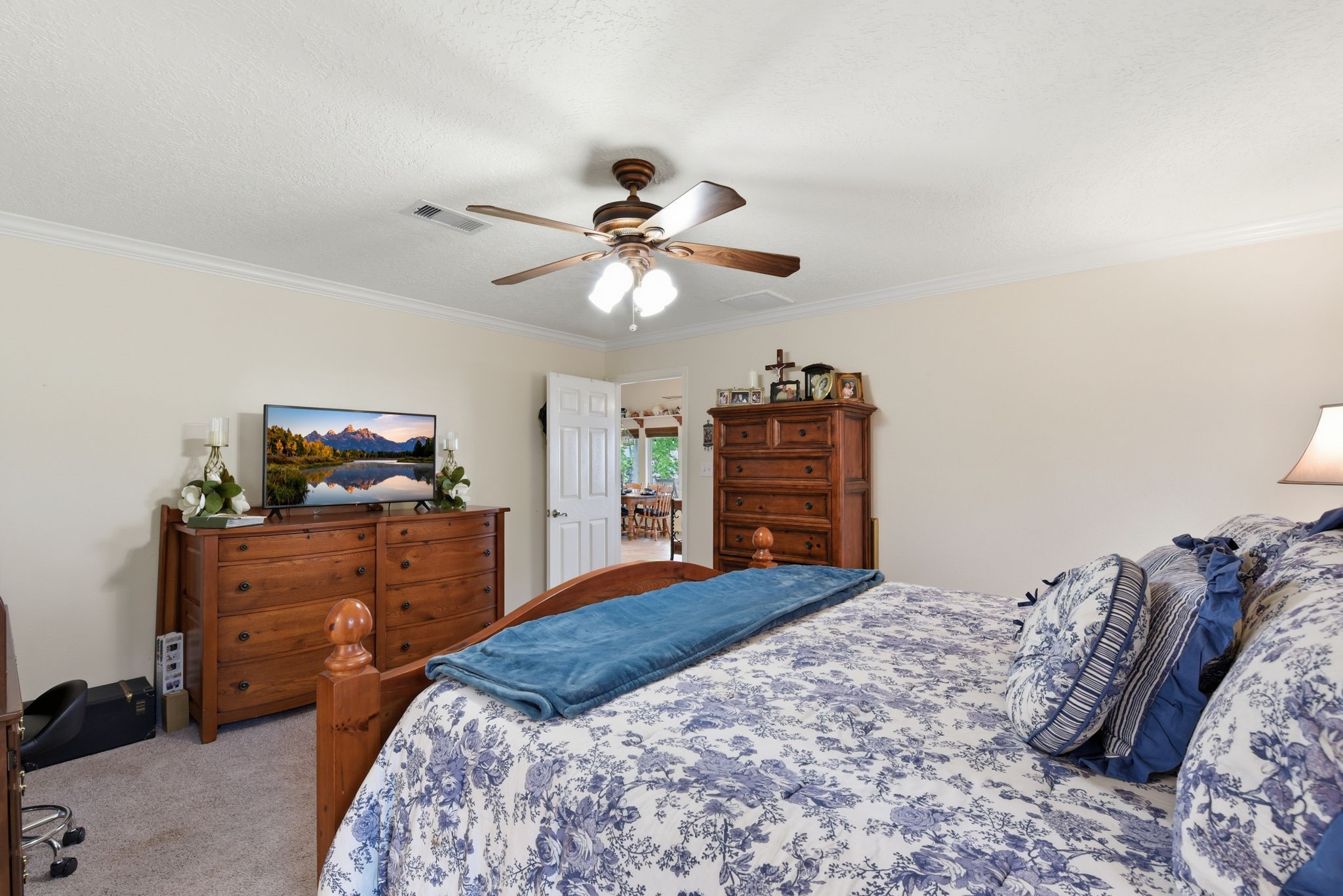 201 Lords Circle Coldspring, TX 77331 - Photo 21 of 48 a bedroom with a bed and a dresser
