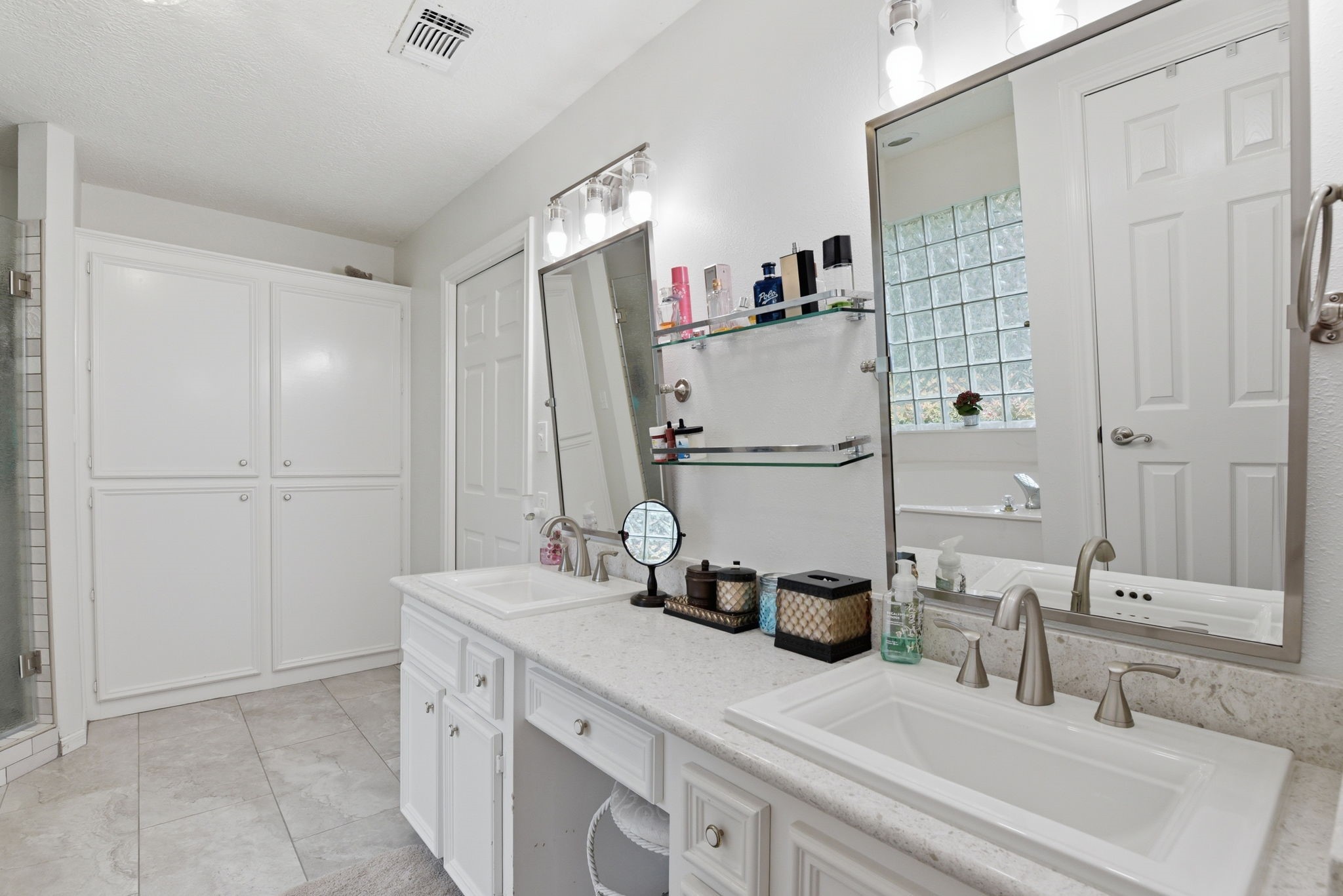201 Lords Circle Coldspring, TX 77331 - Photo 22 of 48 a bathroom with a double vanity sink and a mirror