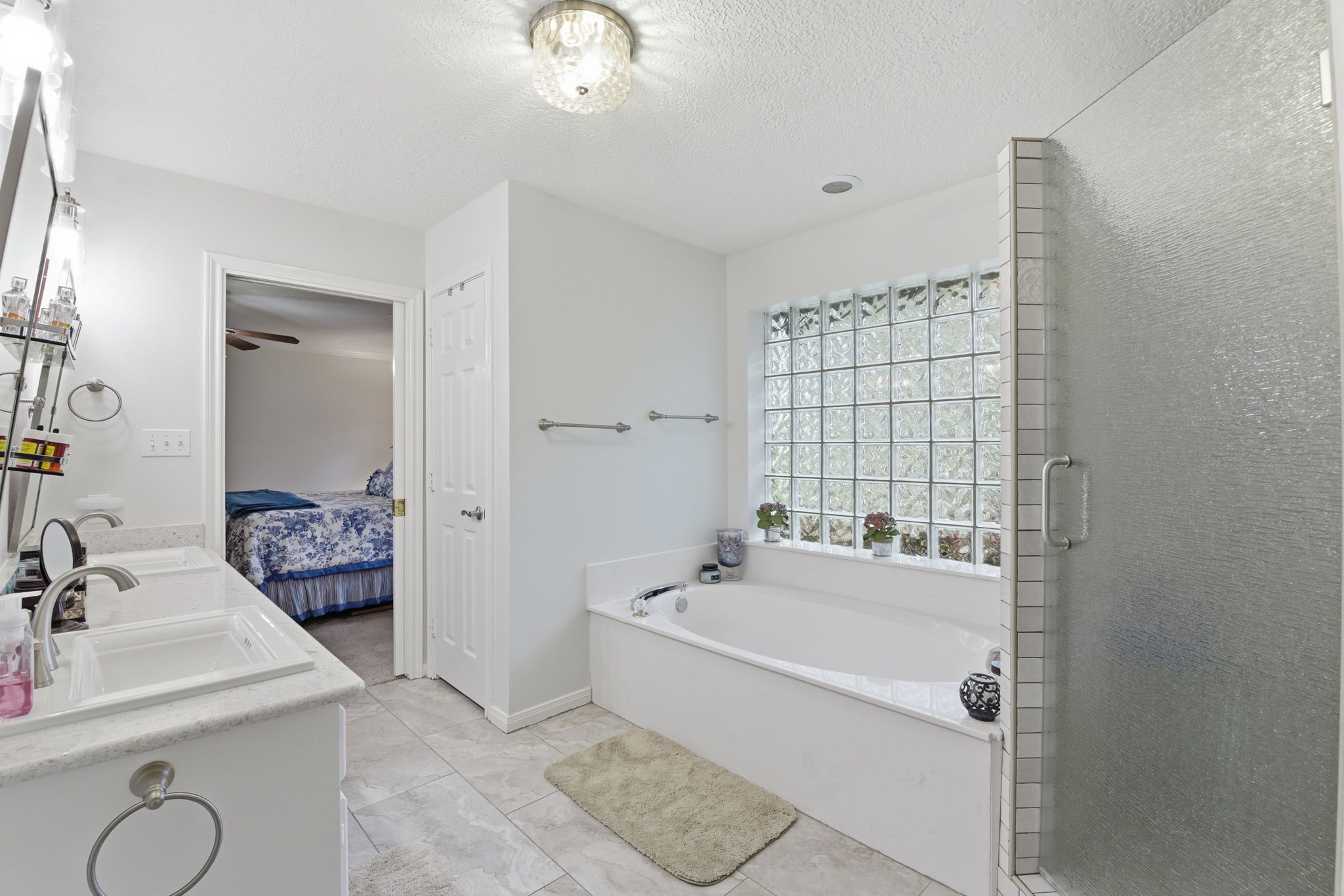 201 Lords Circle Coldspring, TX 77331 - Photo 23 of 48 a bathroom with a tub sink and mirror