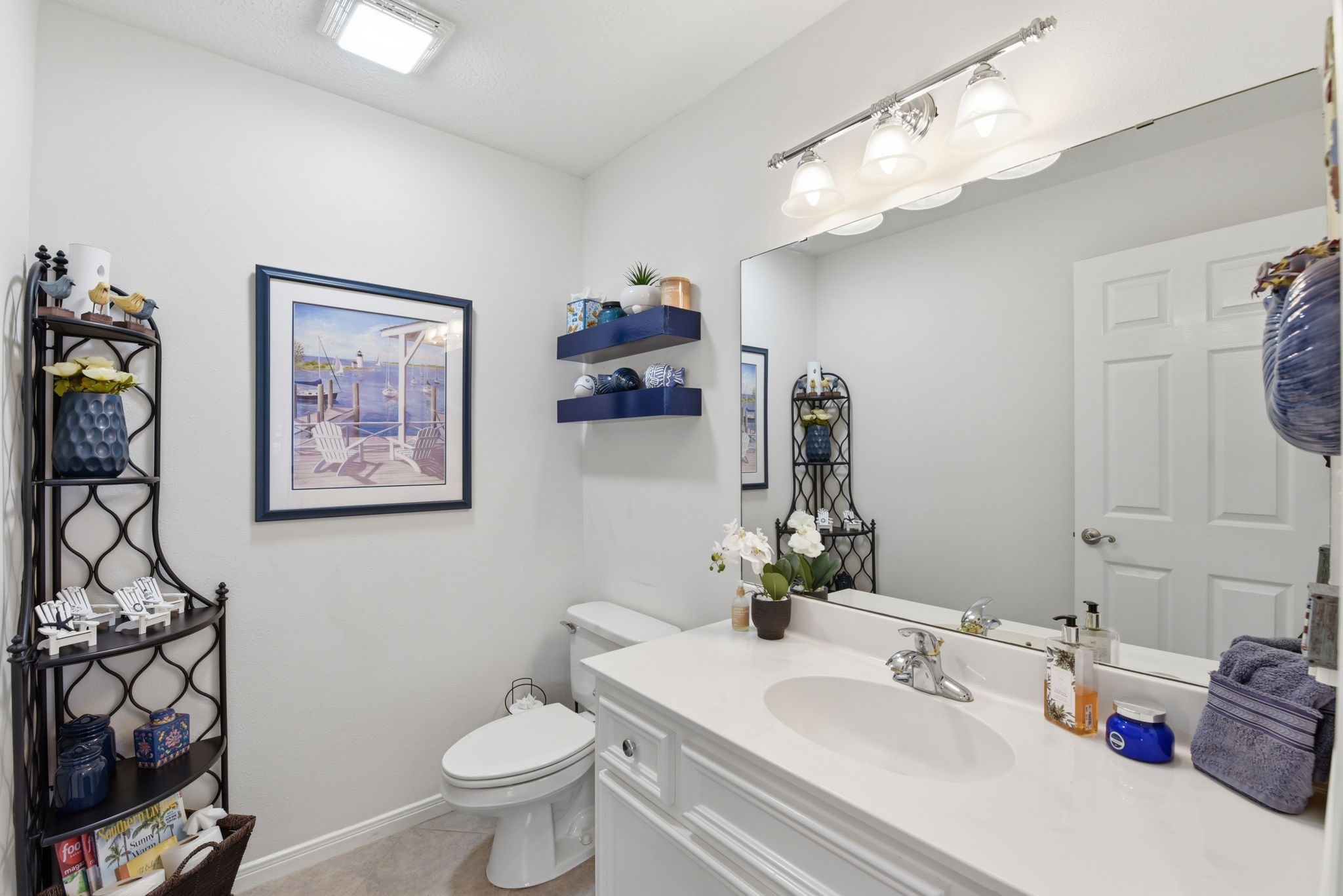 201 Lords Circle Coldspring, TX 77331 - Photo 27 of 48 a bathroom with a sink vanity mirror and toilet