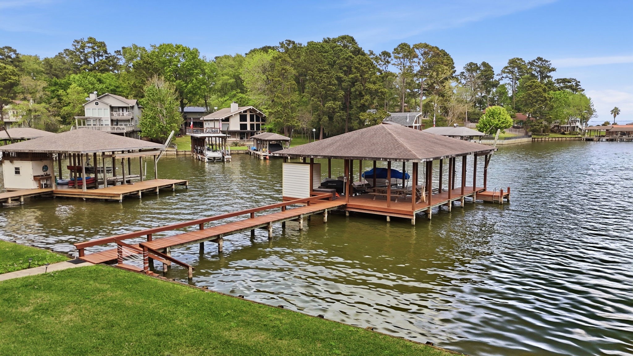 201 Lords Circle Coldspring, TX 77331 - Photo 3 of 48 a view of a lake with a house swimming pool and outdoor space
