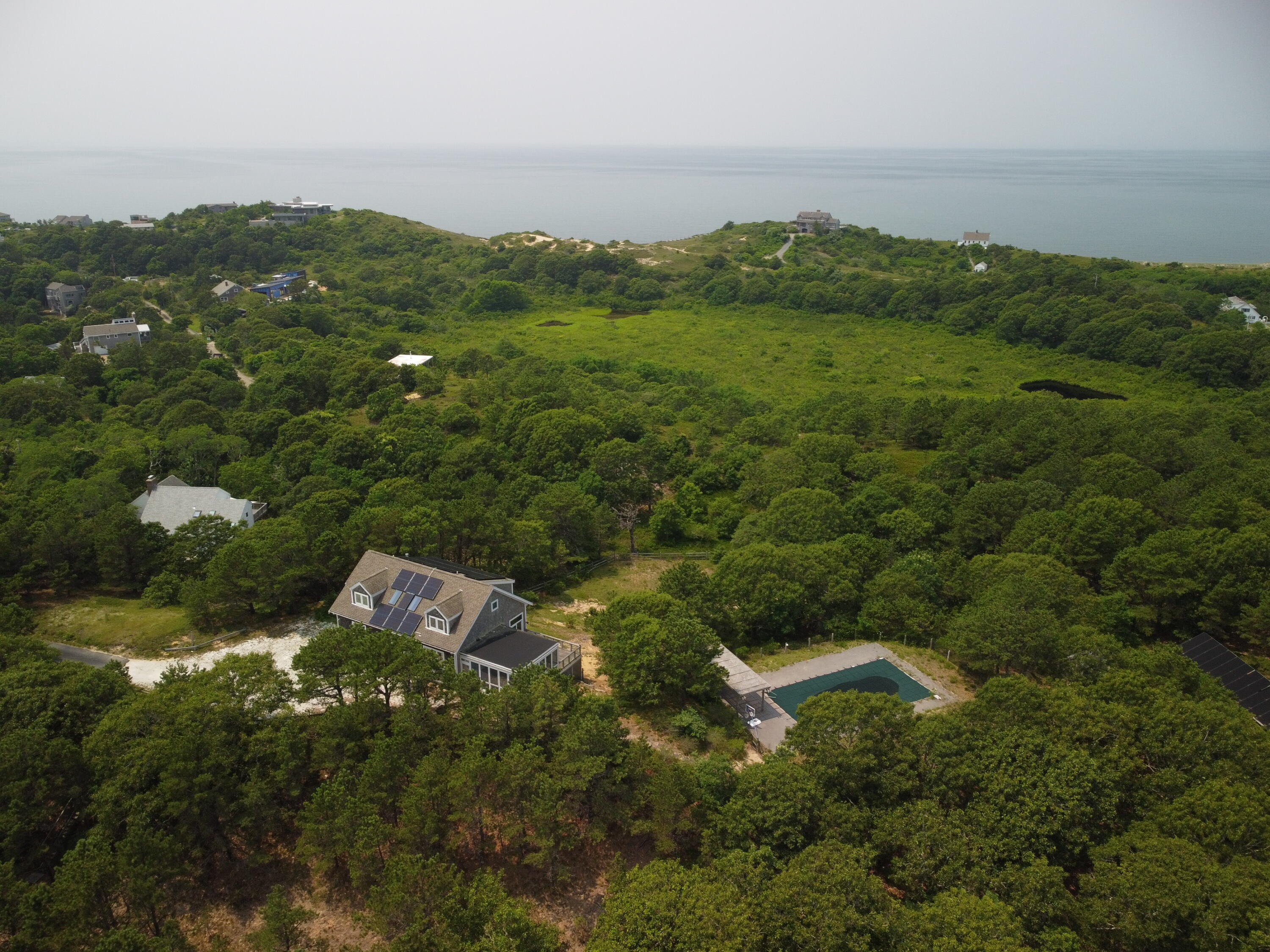 11 Cooper Road Truro, MA 02666 - Photo 3 of 8 an aerial view of a house with a yard
