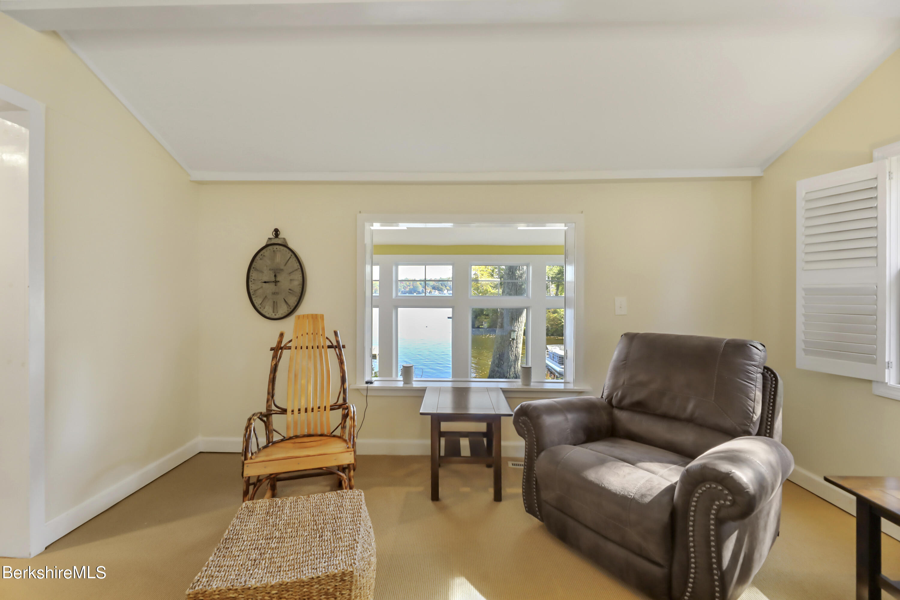 29 South Bay Road Otis, MA 01029 - Photo 12 of 27 a living room with furniture a large window and dining table