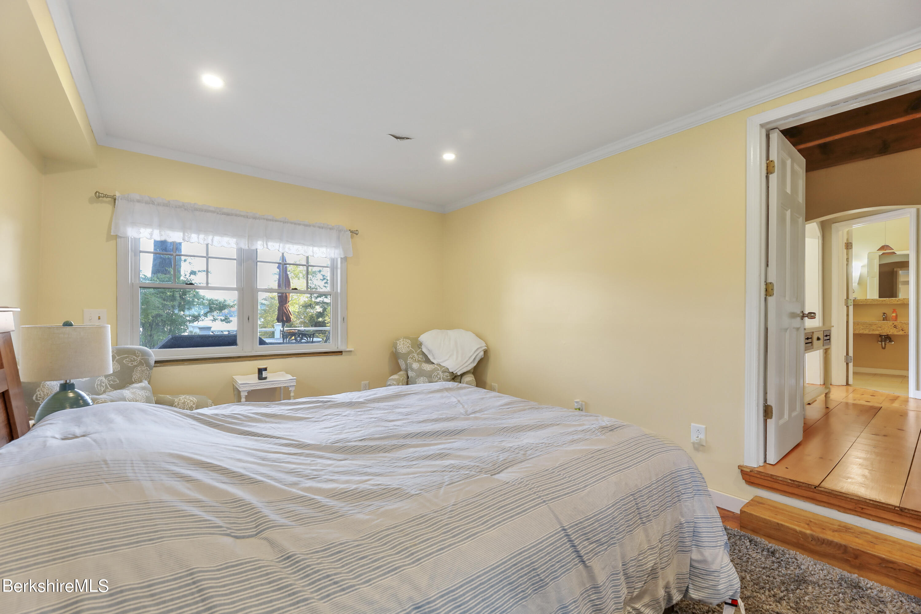 29 South Bay Road Otis, MA 01029 - Photo 15 of 27 a bed sitting in a spacious bedroom next to a window
