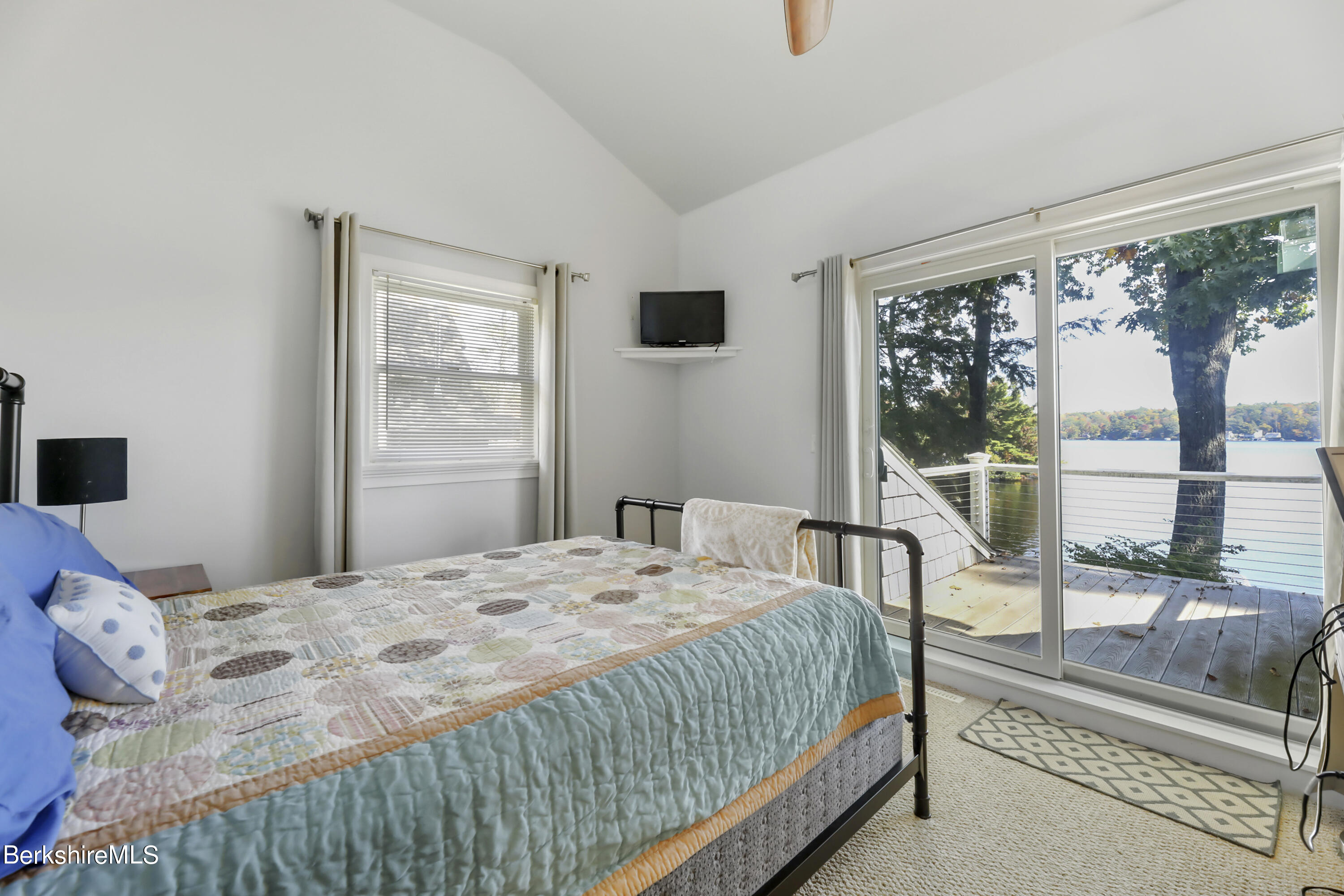29 South Bay Road Otis, MA 01029 - Photo 16 of 27 a bedroom with a bed and a large window