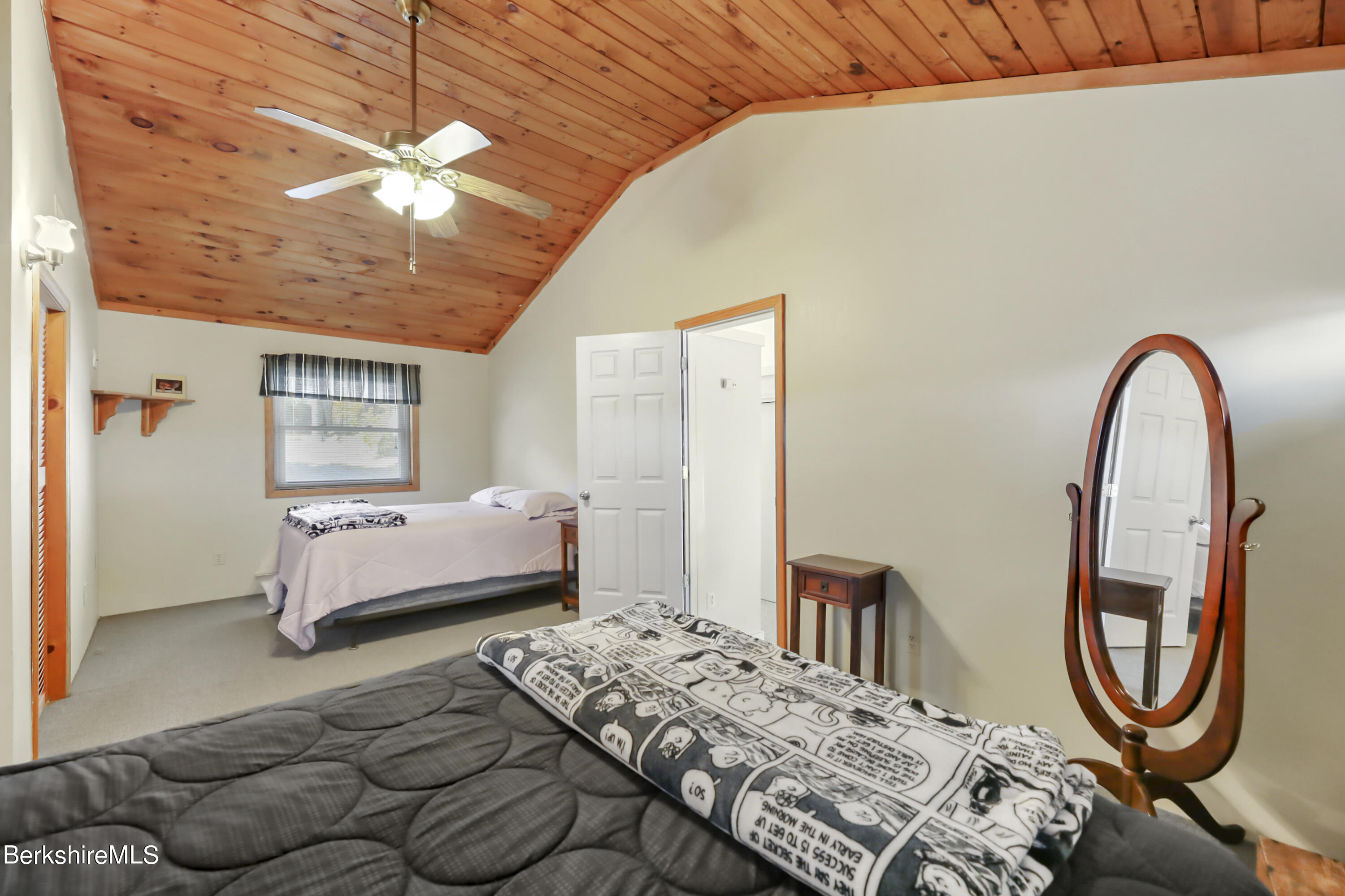 29 South Bay Road Otis, MA 01029 - Photo 18 of 27 a bedroom with bed and a chandelier