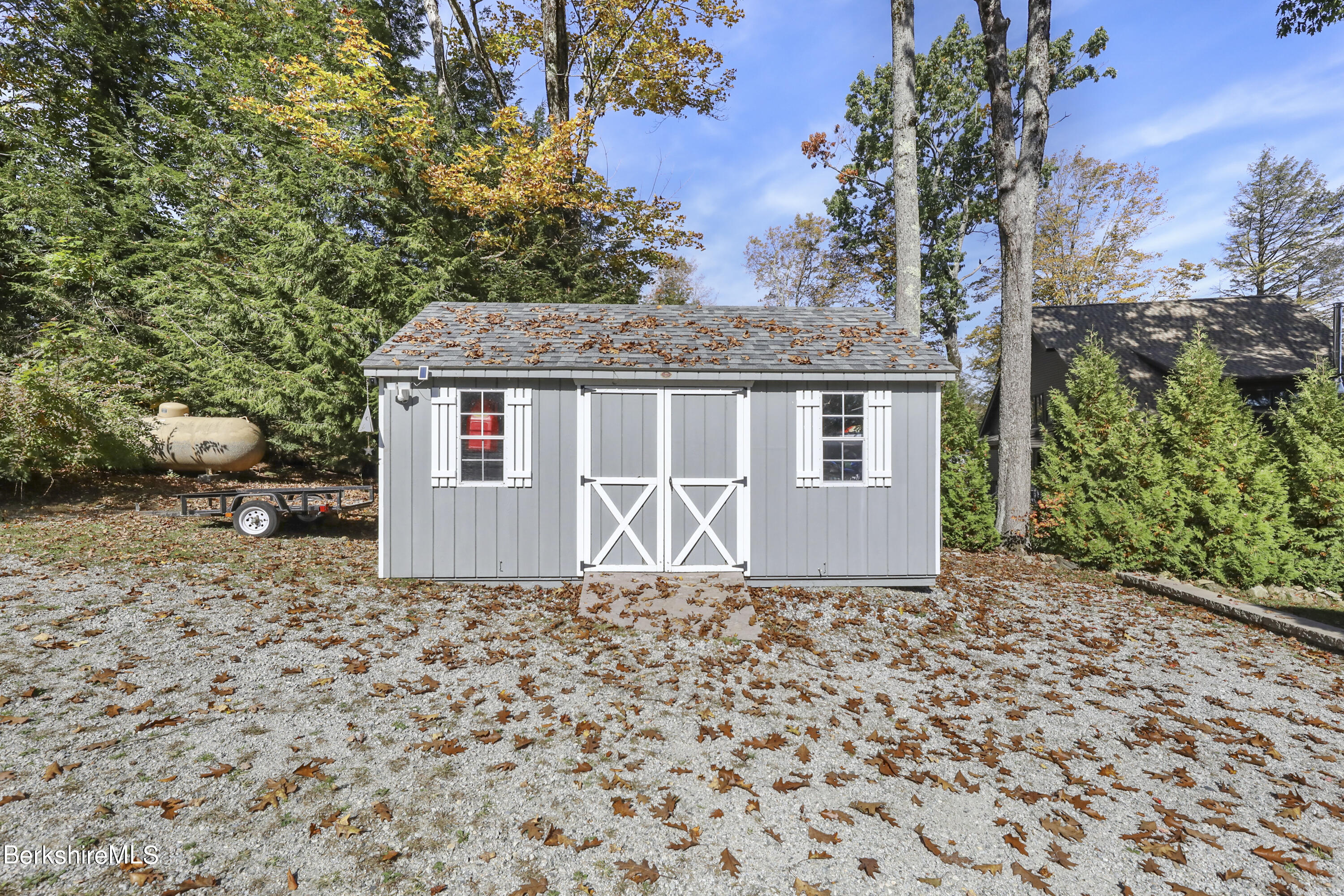 29 South Bay Road Otis, MA 01029 - Photo 25 of 27 a front view of a house with a garden
