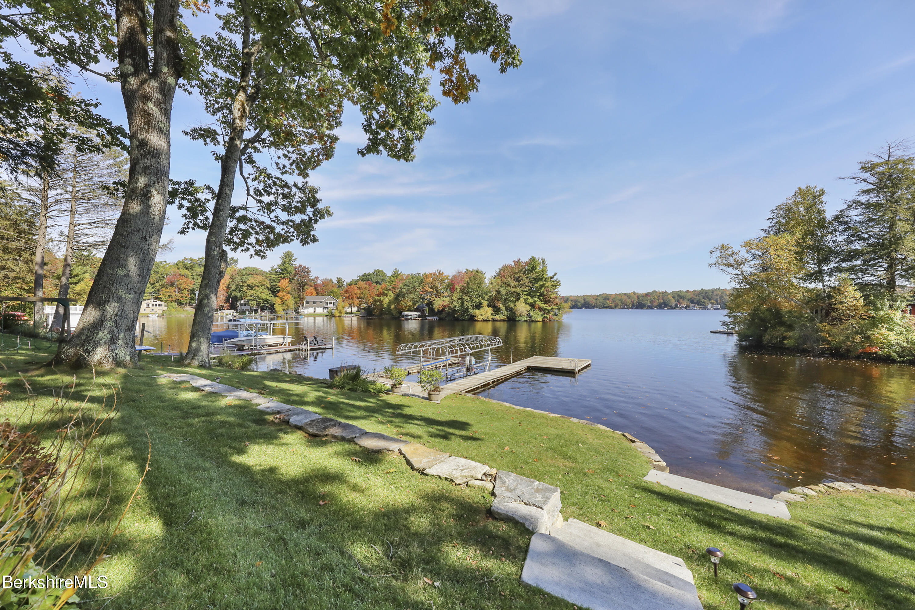 29 South Bay Road Otis, MA 01029 - Photo 3 of 27 a view of a lake with houses in the background