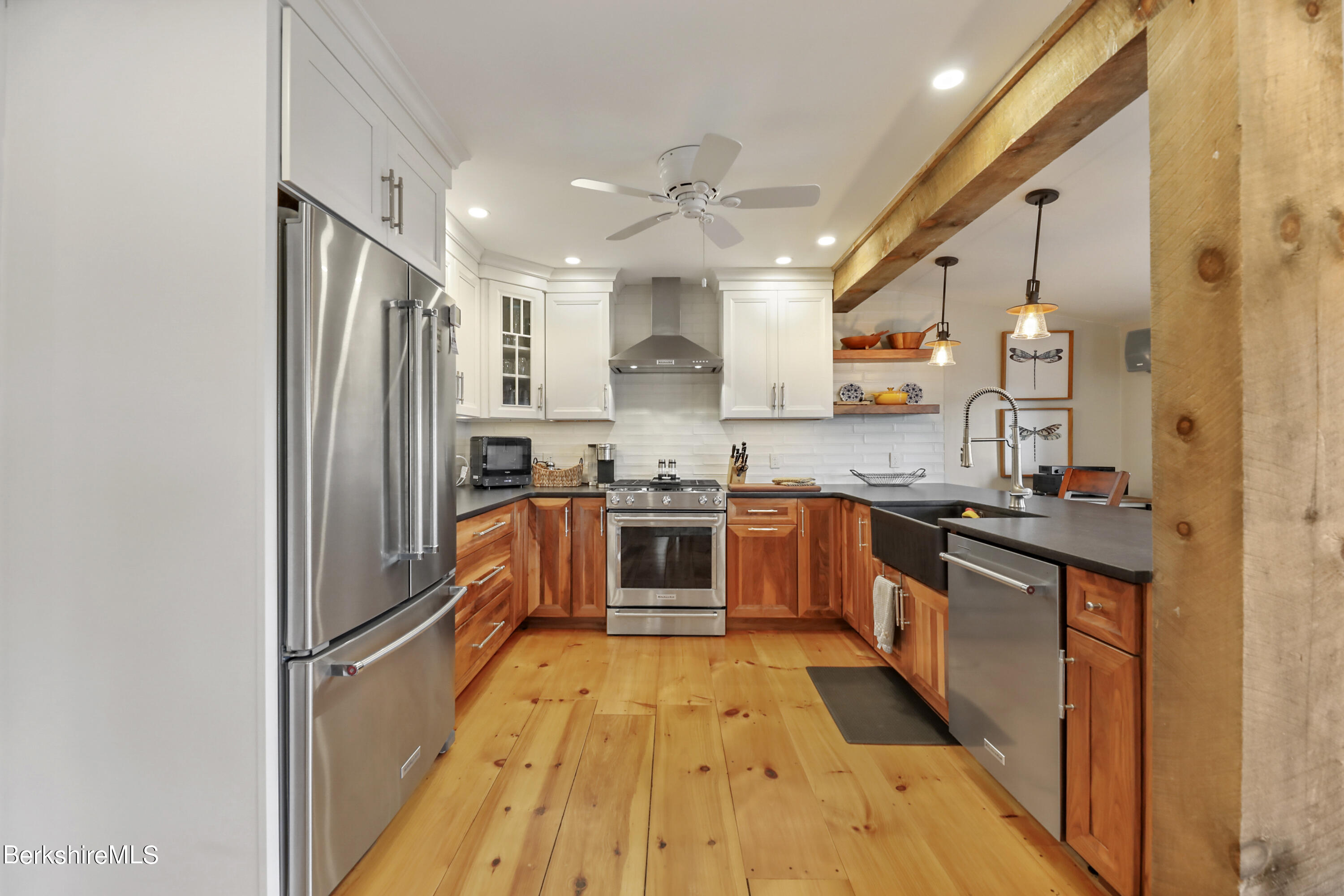 29 South Bay Road Otis, MA 01029 - Photo 8 of 27 a kitchen with stainless steel appliances granite countertop a stove a sink and a refrigerator