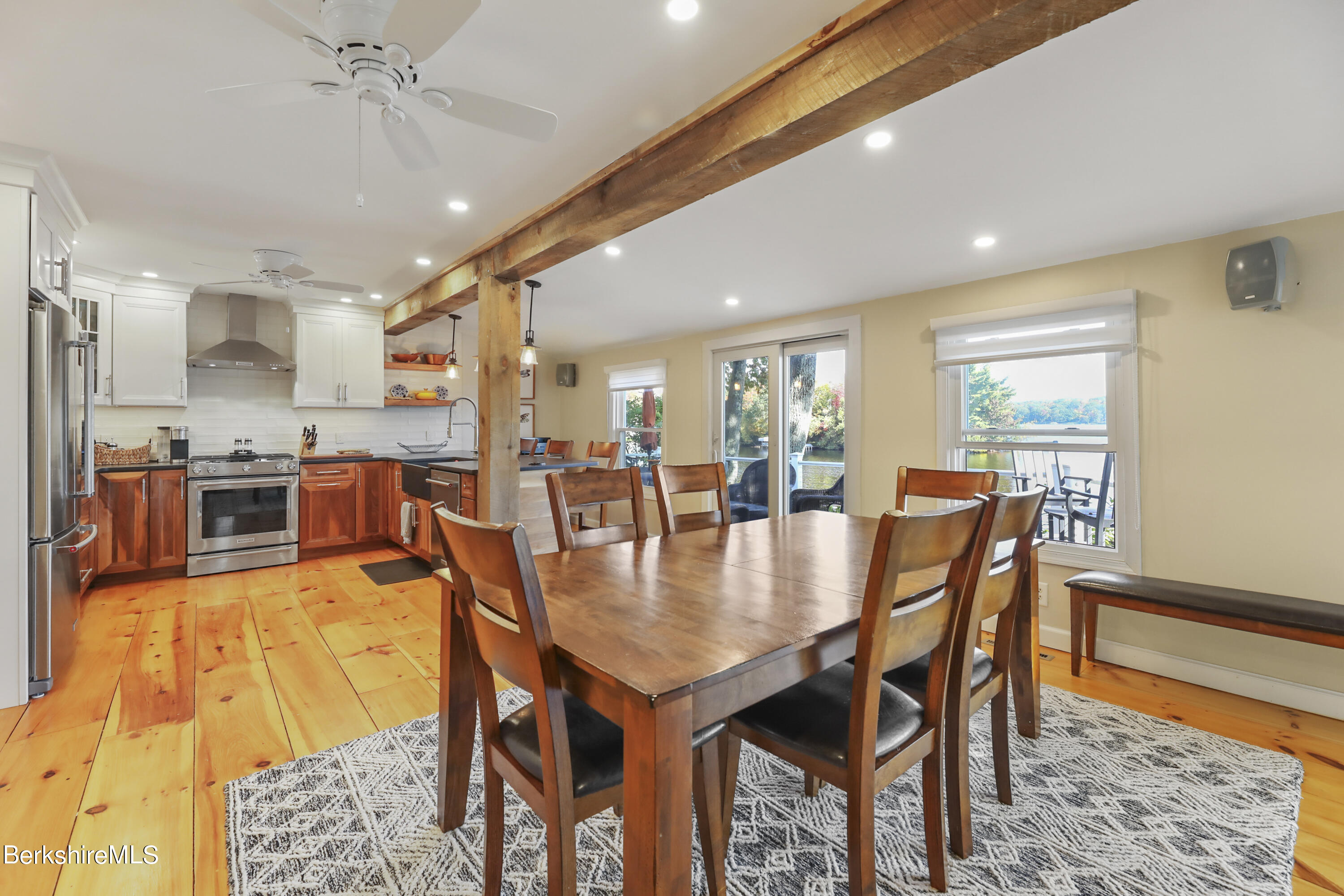 29 South Bay Road Otis, MA 01029 - Photo 10 of 27 a dining room with furniture a rug and wooden floor