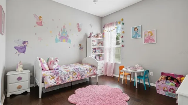 a bedroom with bed and a couch