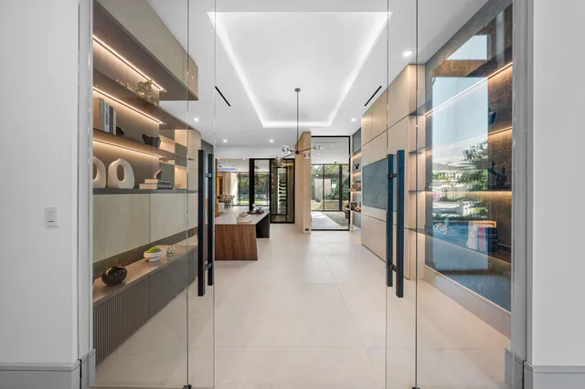 a bathroom with a toilet a sink and a large mirror