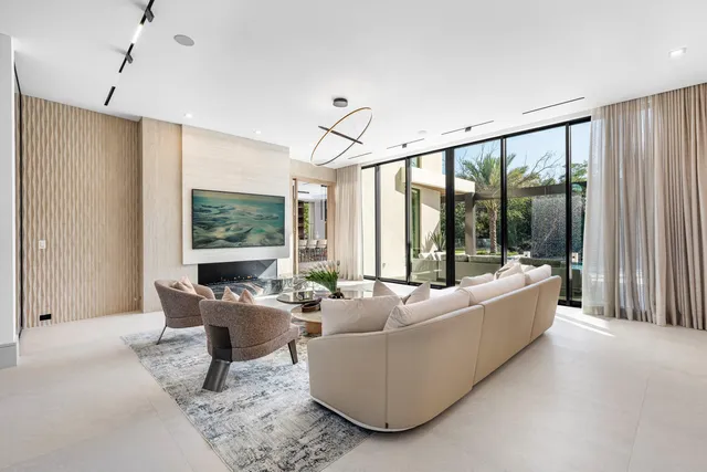 a bathroom with a granite countertop sink a toilet a mirror and shower