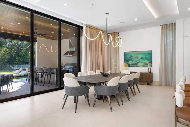 a view of a house with backyard porch and sitting area