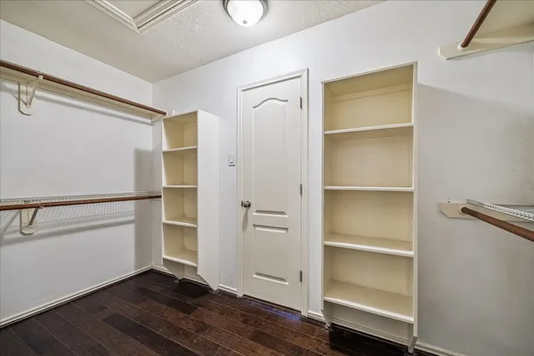 a view of an empty walk in closet