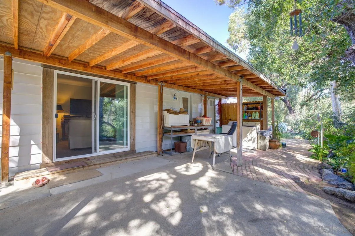 31050 Lilac Road Valley Center, CA 92082 - Photo 27 of 35 a view of a patio with table and chairs and potted plants