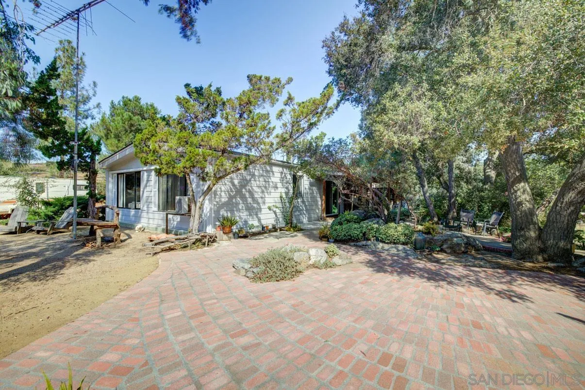31050 Lilac Road Valley Center, CA 92082 - Photo 31 of 35 a view of a house with backyard and sitting area