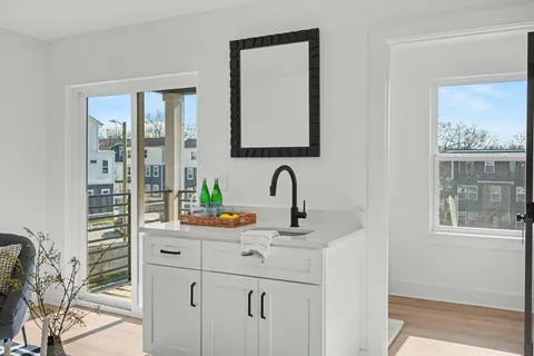 a kitchen with stainless steel appliances a sink and a window