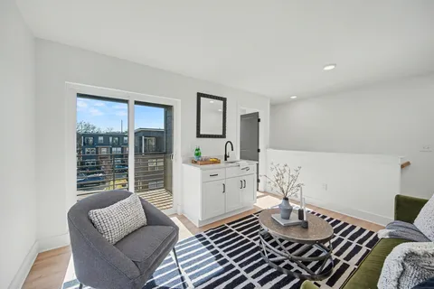 a living room with furniture and a table
