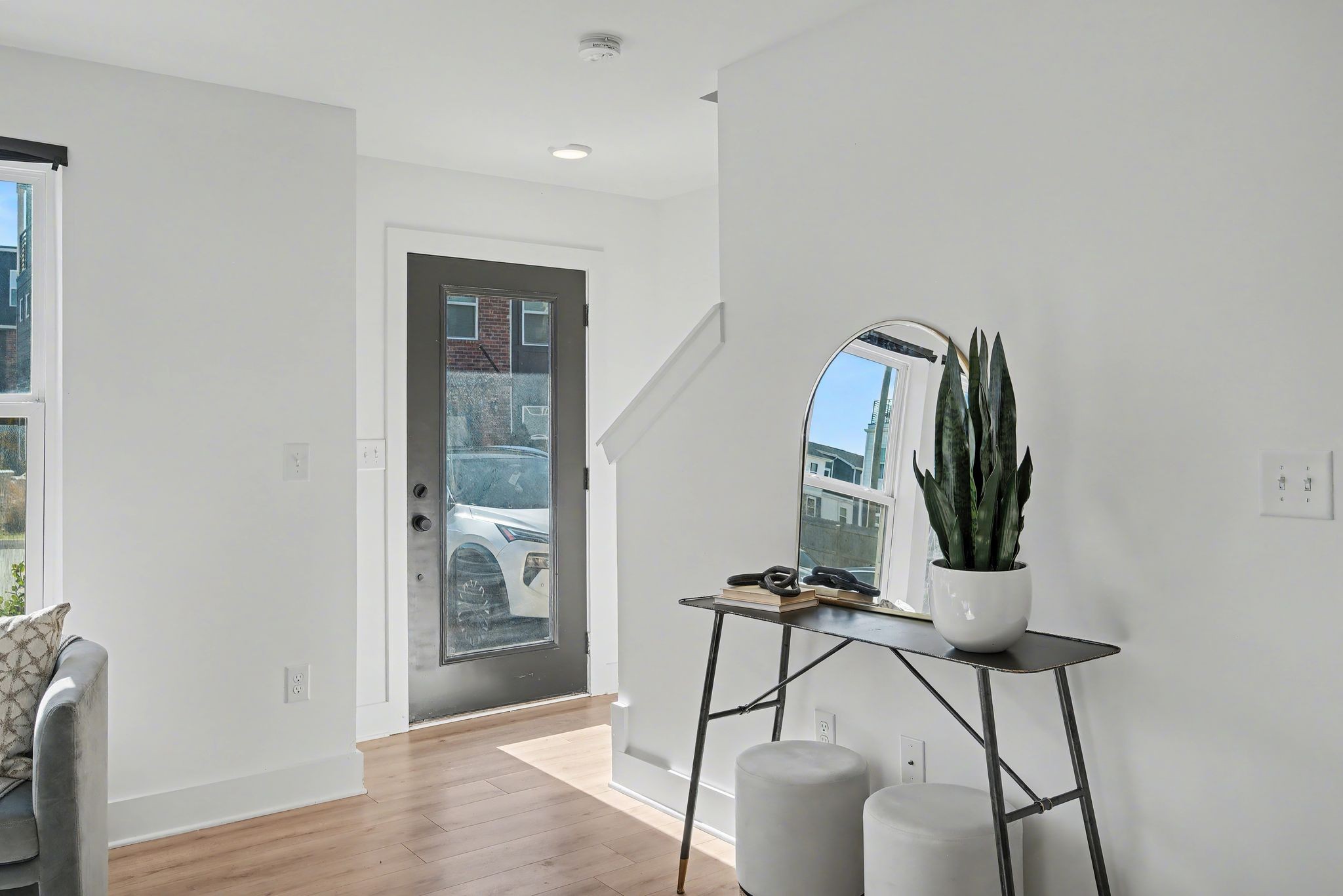 102 Duke Street, Unit 7 Nashville, TN 37207 - Photo 2 of 25 a view of a room with a mirror and wooden floor