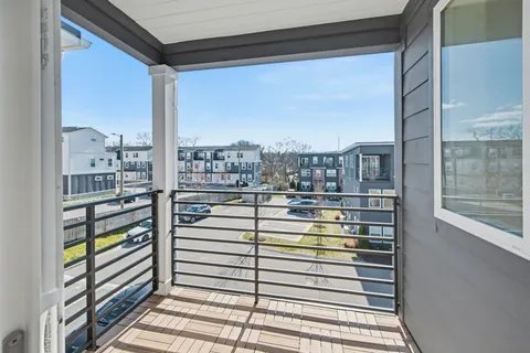 a view of a balcony with city view