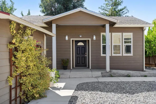 a front view of a house with garden