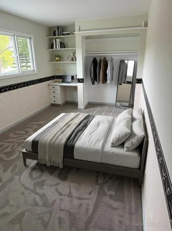 a bedroom with a bed and window