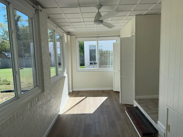 a view of hallway with windows