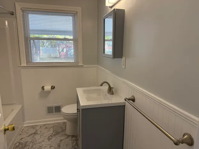 a bathroom with a sink and a toilet