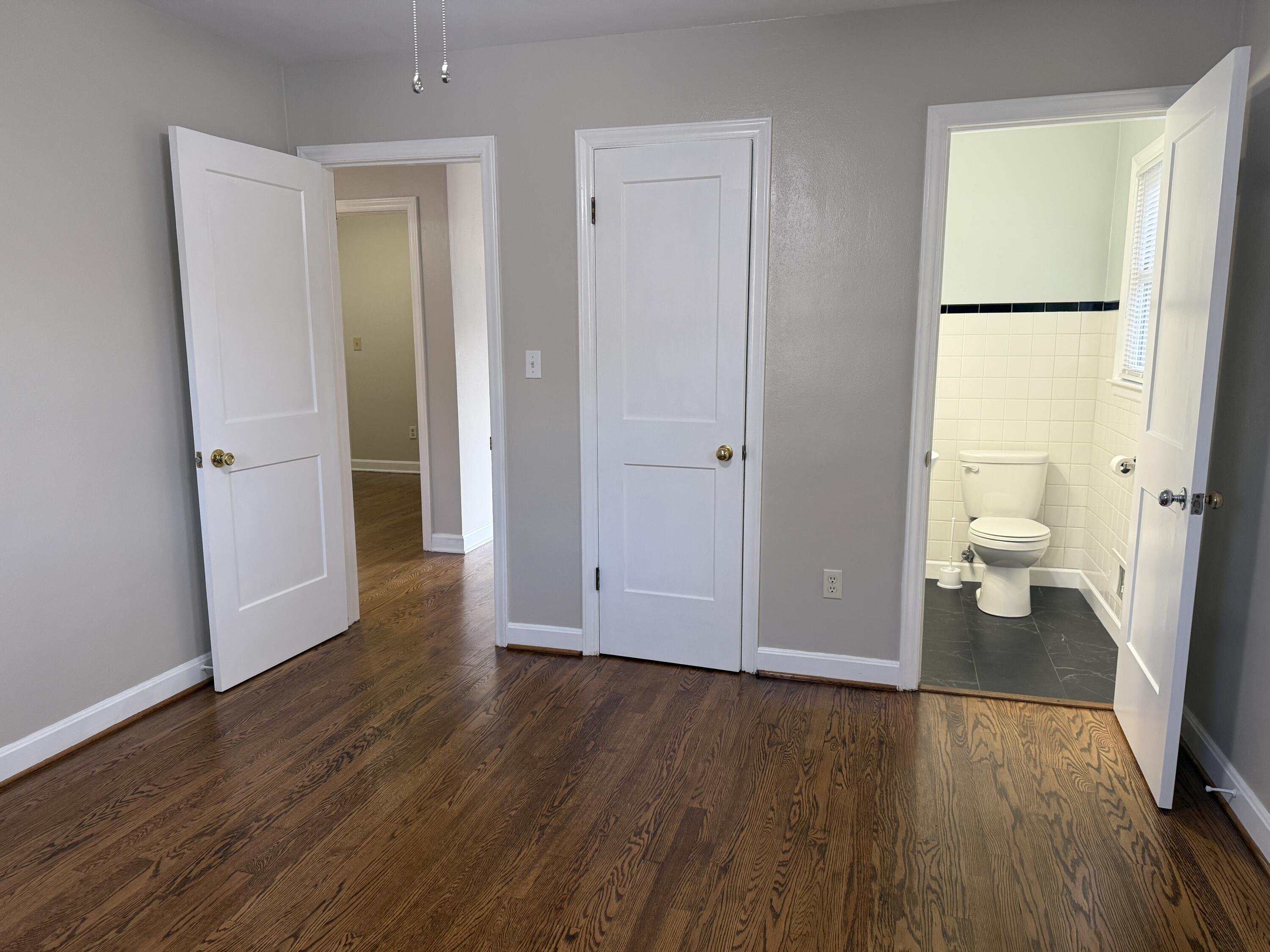 222 Ross Street Salem, VA 24153 - Photo 10 of 20 a view of a room with wooden floor and bathroom view