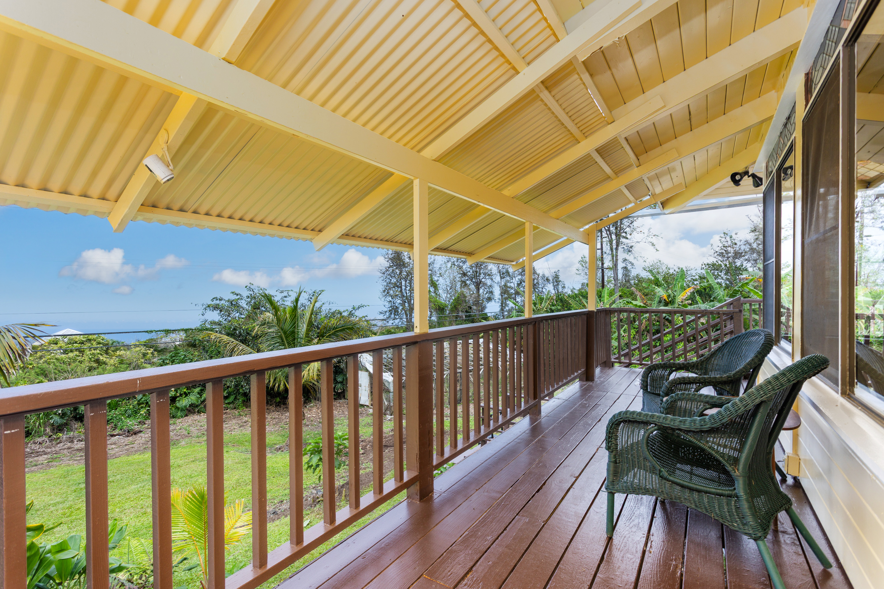 89-1426 Hawaii Belt Road Captain Cook, HI 96704 - Photo 2 of 30 a view of balcony with wooden floor and seating space