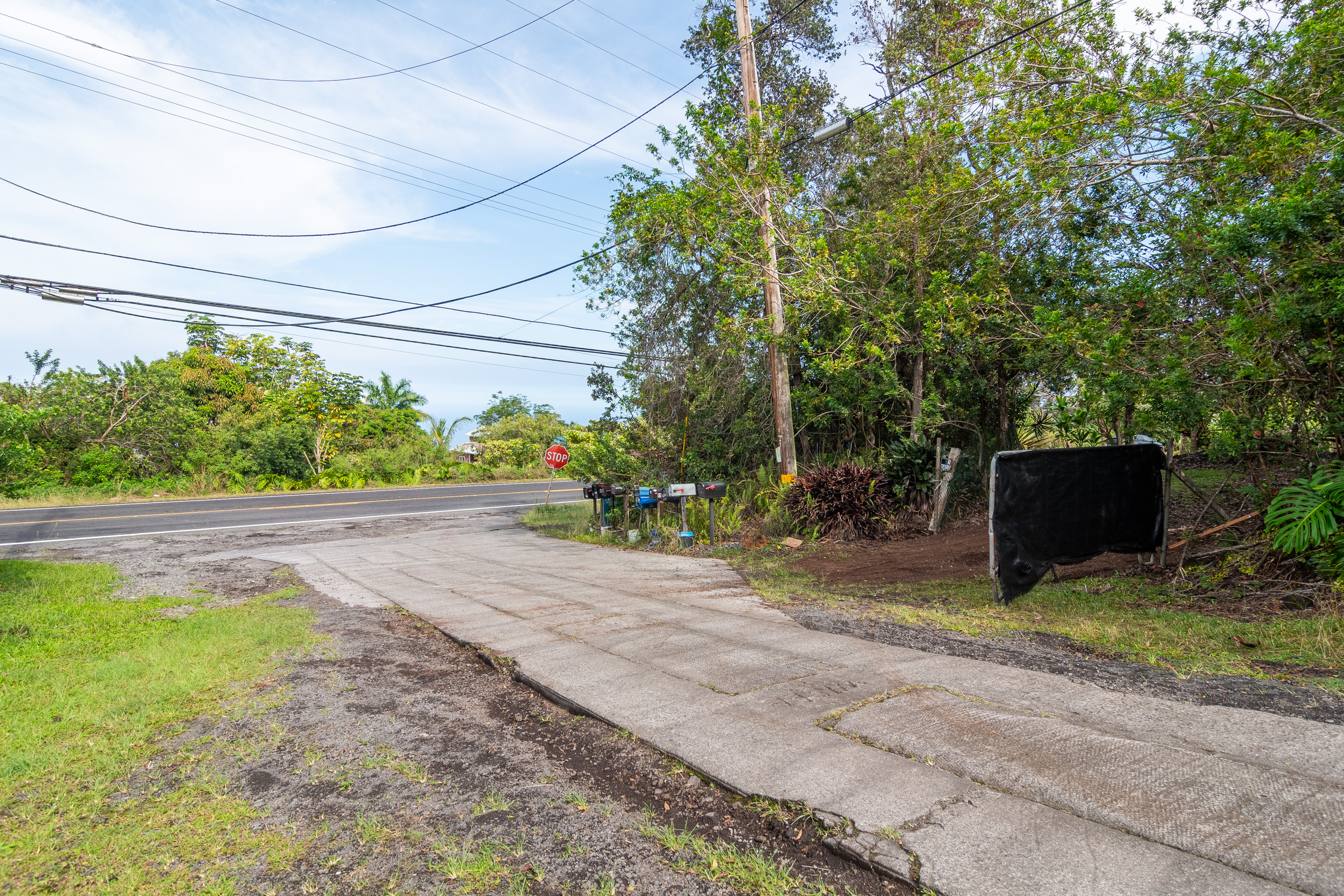 89-1426 Hawaii Belt Road Captain Cook, HI 96704 - Photo 27 of 30 a view of backyard with outdoor seating and plants