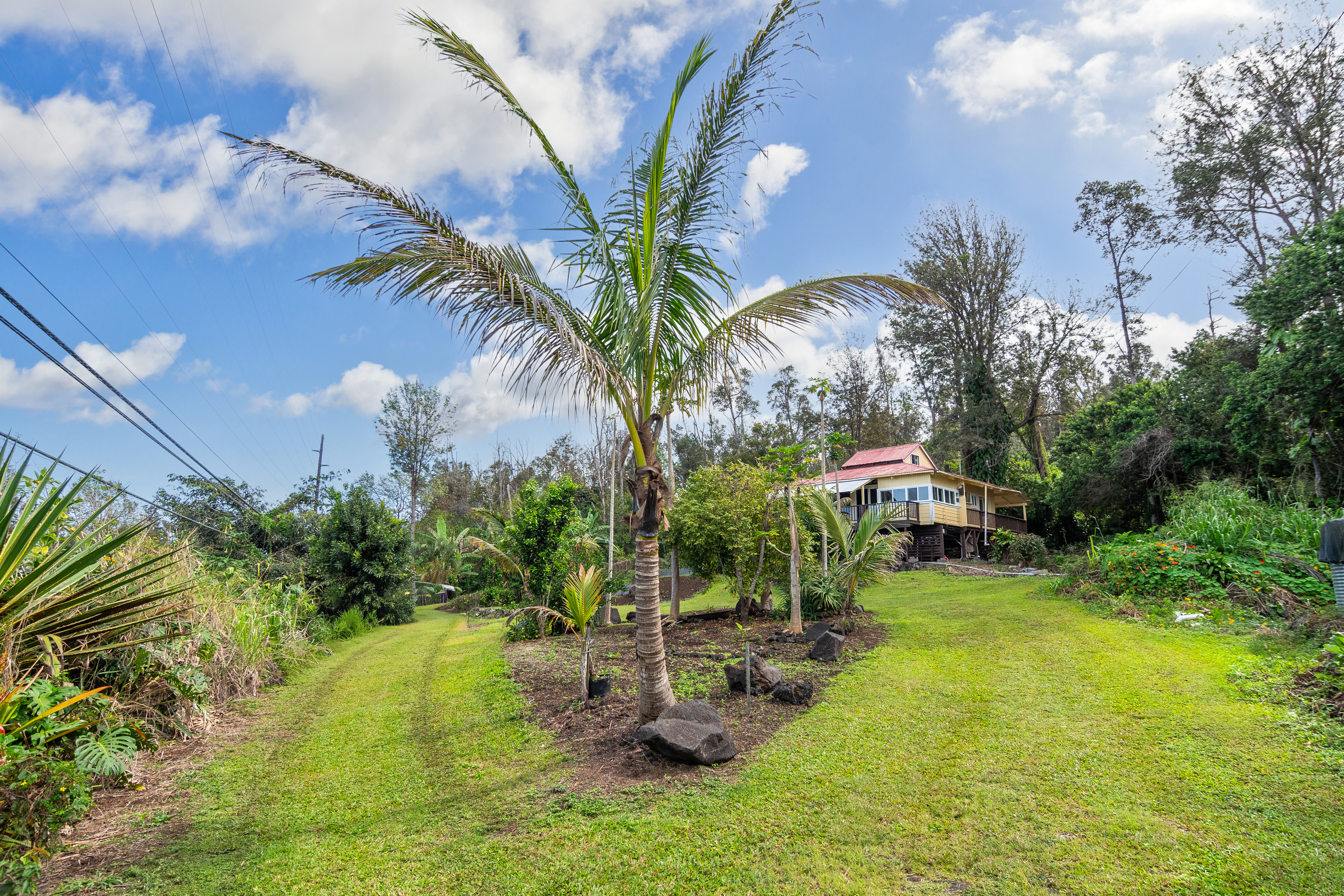 89-1426 Hawaii Belt Road Captain Cook, HI 96704 - Photo 29 of 30 a view of a house with a yard