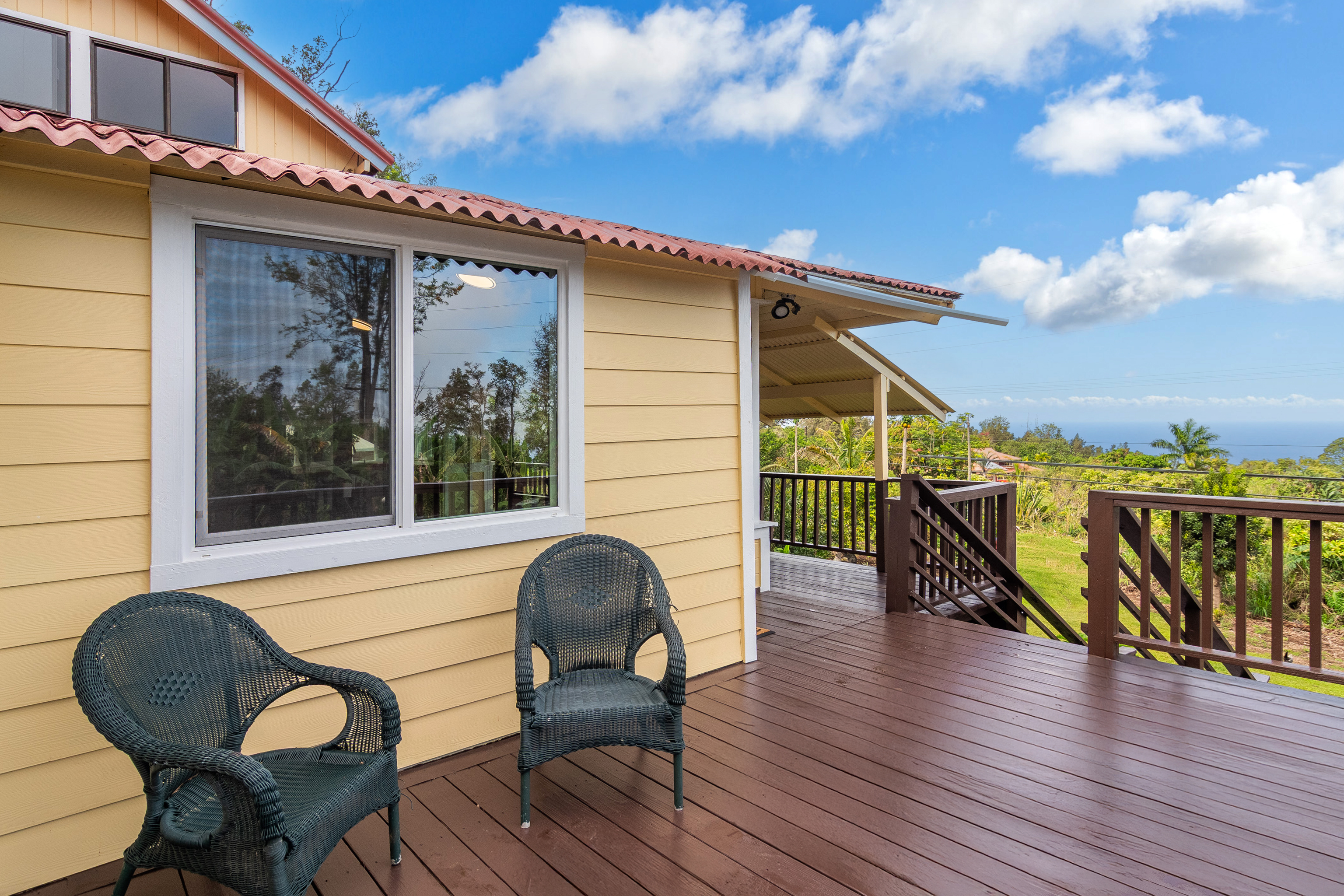 89-1426 Hawaii Belt Road Captain Cook, HI 96704 - Photo 3 of 30 a balcony with table and chairs