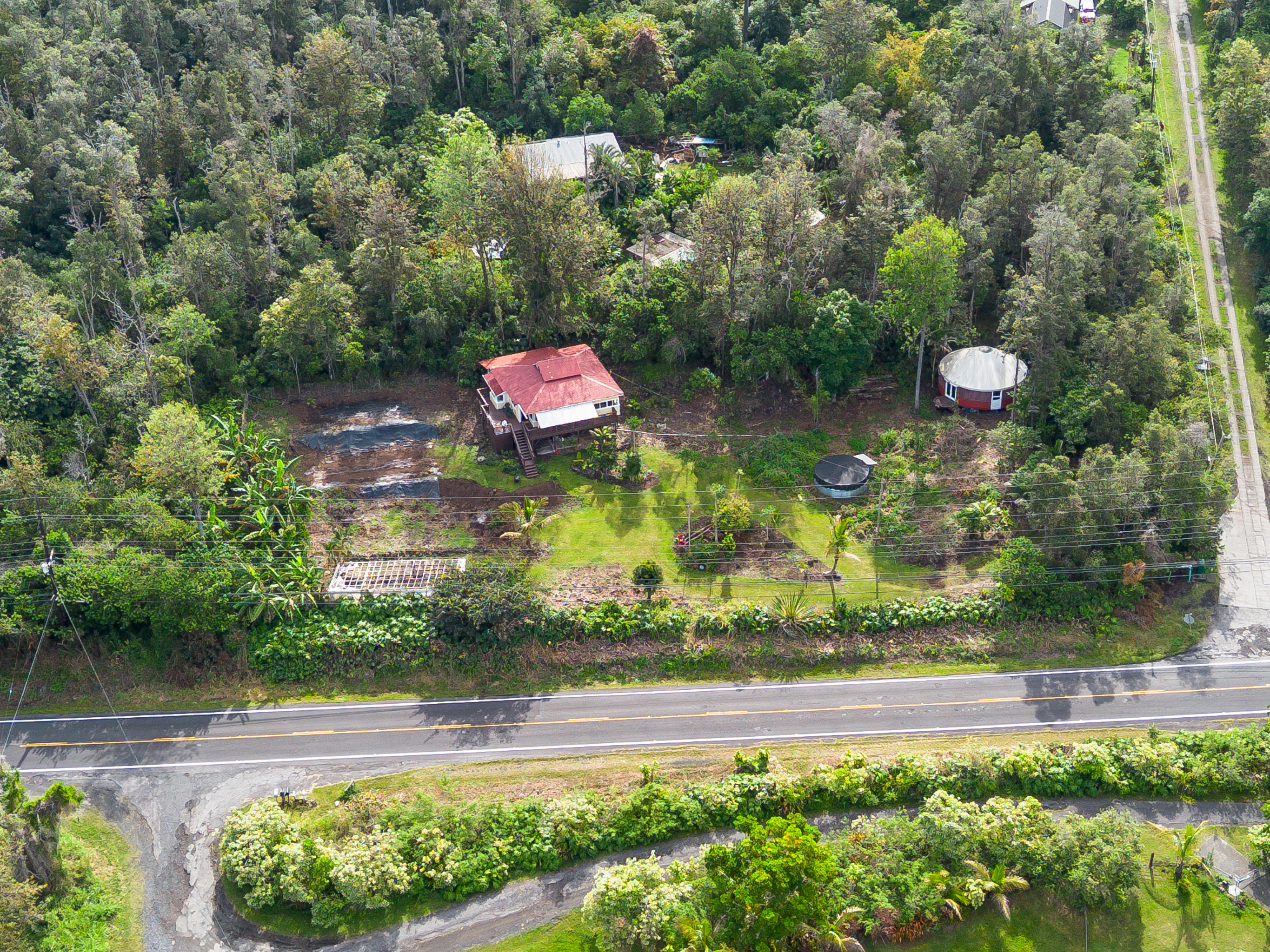 89-1426 Hawaii Belt Road Captain Cook, HI 96704 - Photo 5 of 30 a view of a lake and a yard