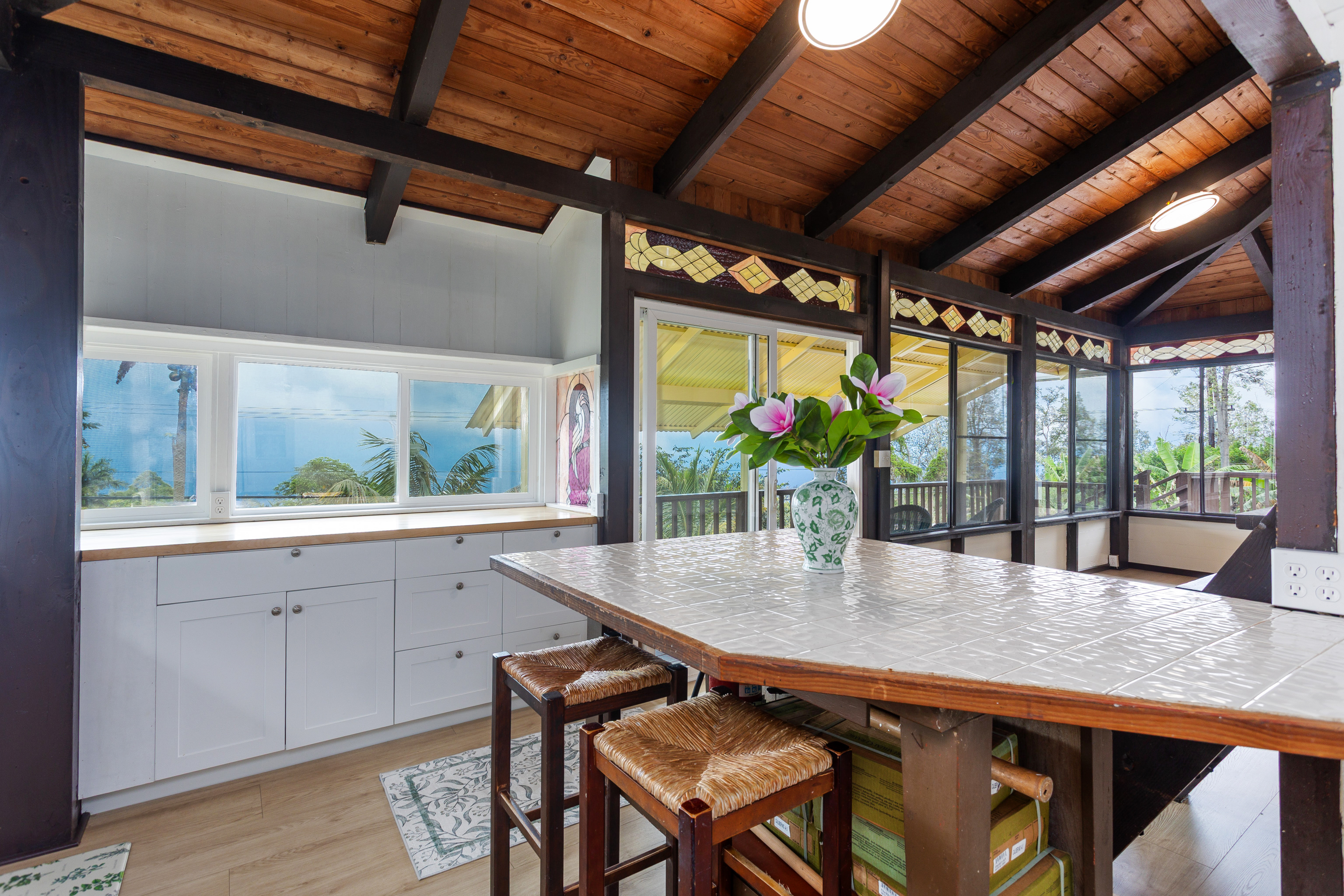 89-1426 Hawaii Belt Road Captain Cook, HI 96704 - Photo 10 of 30 a dining room with furniture window and wooden floor