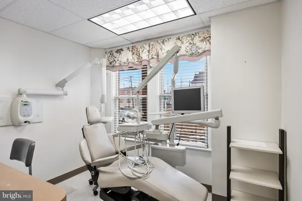 a bathroom with a toilet a sink and a mirror