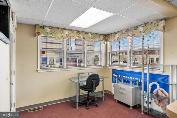 a kitchen with granite countertop a sink and a stove top oven