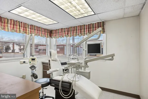 a view of wooden floor and cabinet in a room