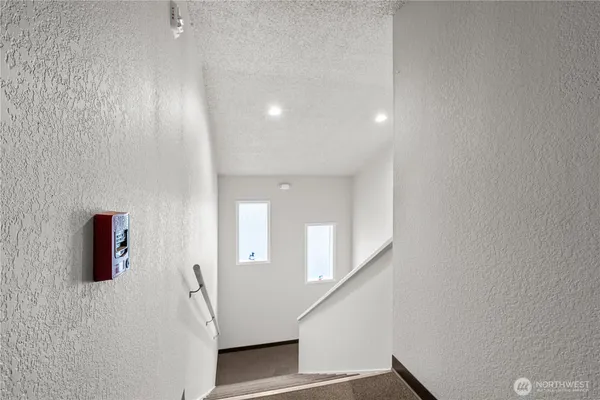 a view of a hallway with an entryway