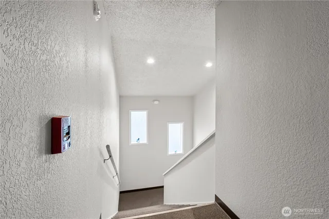 a view of a hallway with an entryway