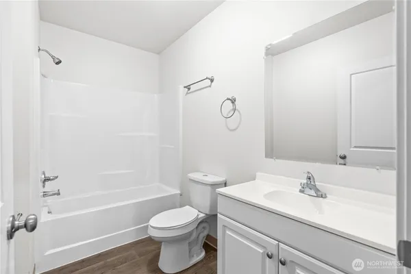 a bathroom with a sink a toilet and a tub