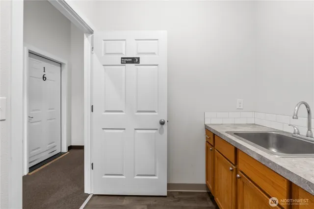 a view of a kitchen from the hallway