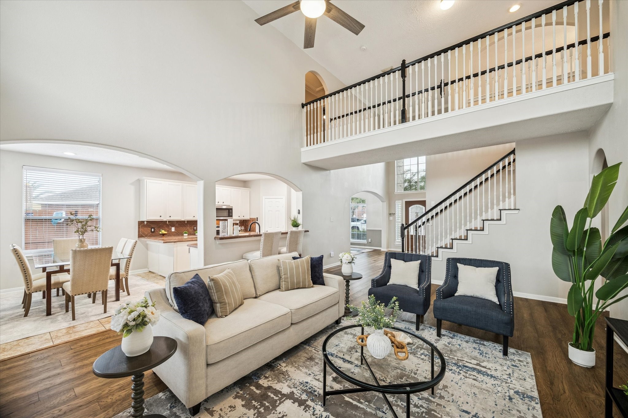 7243 Emerald Run Lane Spring, TX 77379 - Photo 12 of 35 a living room with furniture potted plant and a ceiling fan